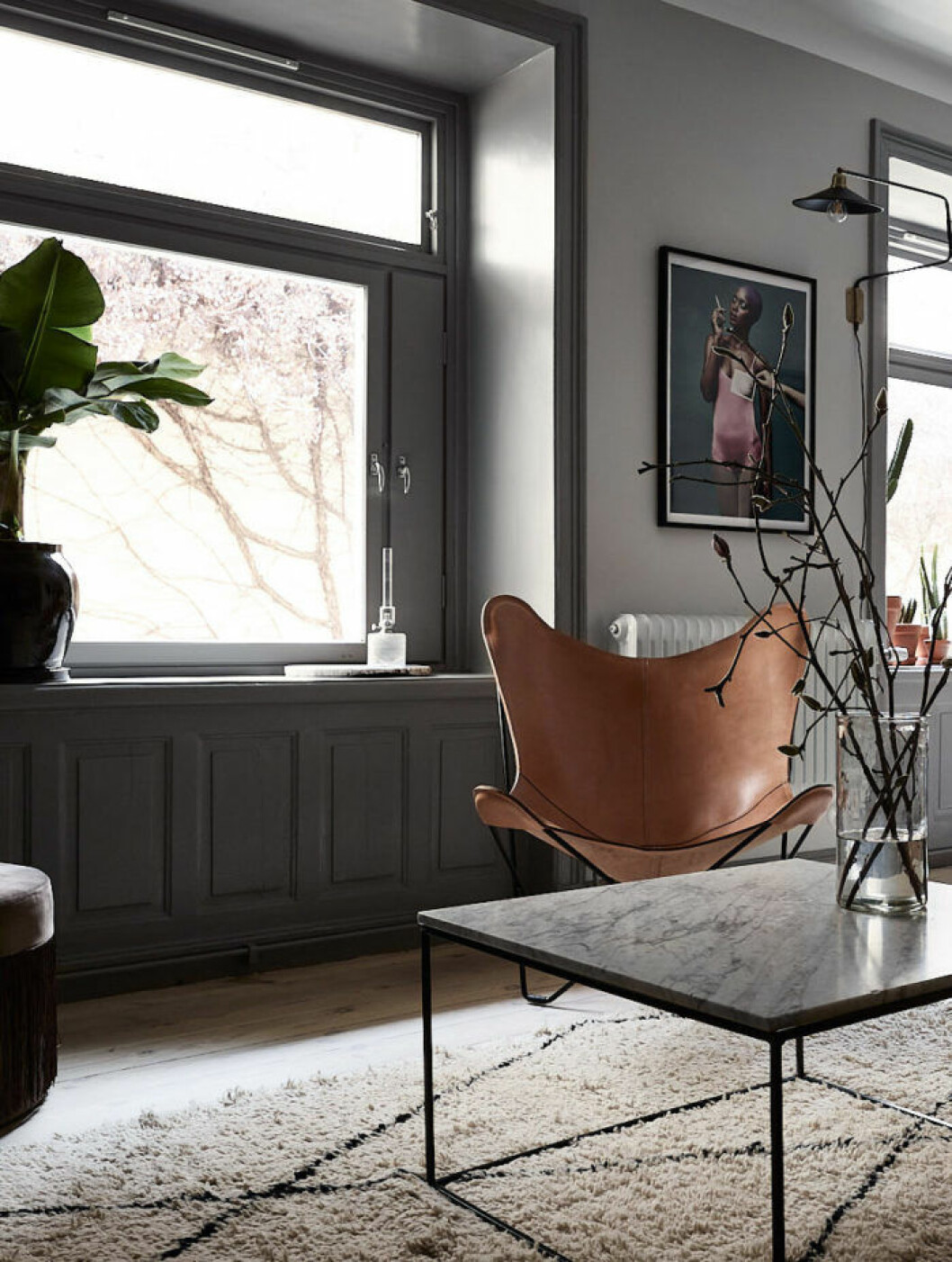 Scandinavian decoration and ideas. Design chair and marble sofa table. Grey walls.