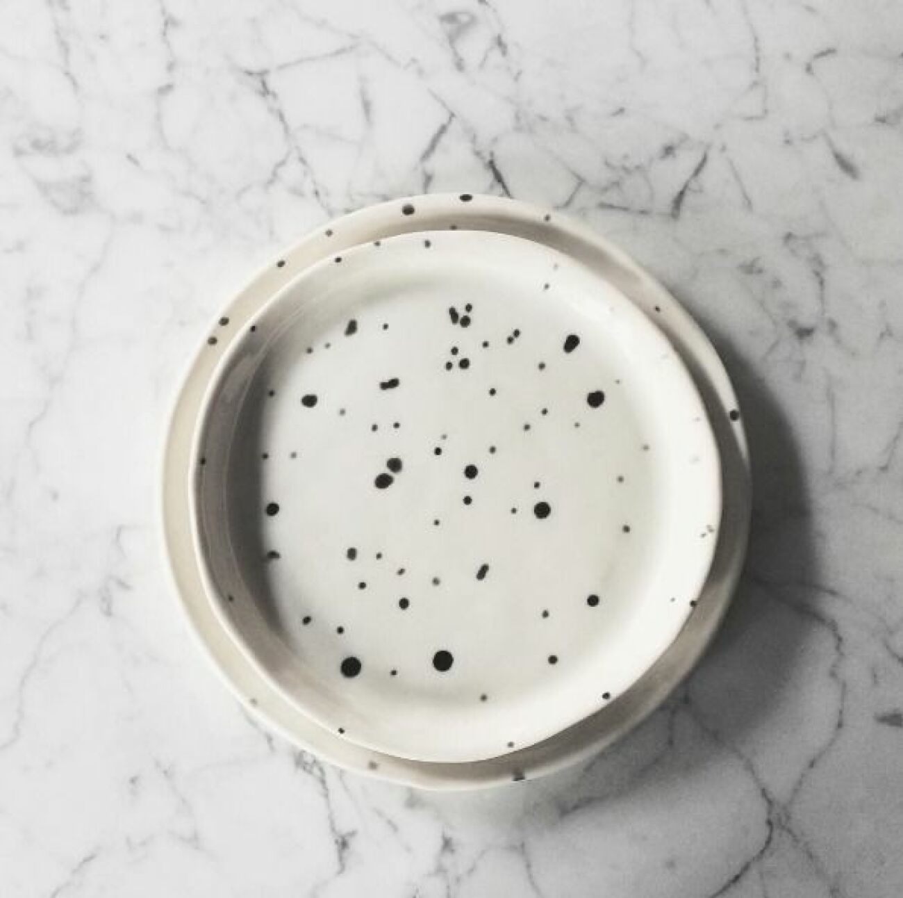 Sunday morning in the studio. Emptying the kiln that was loaded with a few of these darlings: Dalmatian. Porcelain dish with black dalmatian dots. Handmade by me.