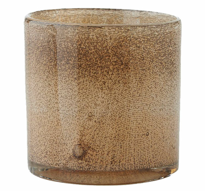 beige ljuslykta i glas
