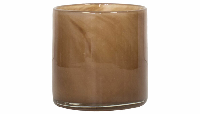 brun ljuslykta i glas