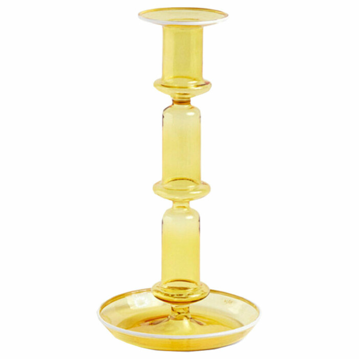 gul ljusstake i glas från hay